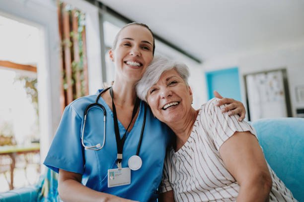 A nurse and a participant smiling together during a study visit